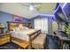 Spacious bedroom features unique rustic-style bed and furnishings at 4545 N 67Th Ave # 1101, Phoenix, AZ 85033