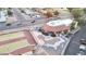 Overhead view of the clubhouse, parking area, and adjacent tennis courts at 4545 N 67Th Ave # 1101, Phoenix, AZ 85033
