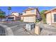 Home exterior featuring a two-car garage, low maintenance desert landscaping, and a red tile roof at 4545 N 67Th Ave # 1101, Phoenix, AZ 85033