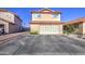 Home featuring a two-car garage, desert landscaping, and a red tile roof at 4545 N 67Th Ave # 1101, Phoenix, AZ 85033