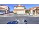 Two-story home with a red tile roof, attached garage, and low maintenance landscaping at 4545 N 67Th Ave # 1101, Phoenix, AZ 85033