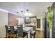 Kitchen with island, brick accent wall, and dark cabinetry at 4545 N 67Th Ave # 1101, Phoenix, AZ 85033