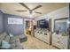 Relaxing living room with tile flooring, ceiling fan, wall decorations, and comfortable seating at 4545 N 67Th Ave # 1101, Phoenix, AZ 85033