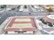 Overhead view of tennis courts, a clubhouse, and a parking area at 4545 N 67Th Ave # 1101, Phoenix, AZ 85033