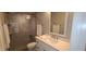 A renovated bathroom featuring a glass-enclosed shower, a quartz countertop vanity, and modern finishes at 5640 E Bell Rd # 1047, Scottsdale, AZ 85254