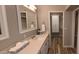 Bathroom features a single vanity with quartz countertop and framed mirror at 5640 E Bell Rd # 1047, Scottsdale, AZ 85254