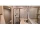 Bathroom features a tiled shower with glass door and single vanity with quartz countertop at 5640 E Bell Rd # 1047, Scottsdale, AZ 85254