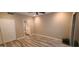 A neutral bedroom featuring tile floors, a ceiling fan, and a doorway to the bathroom at 5640 E Bell Rd # 1047, Scottsdale, AZ 85254