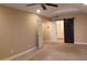 Large bedroom features a barn door to the bathroom and recessed lighting at 5640 E Bell Rd # 1047, Scottsdale, AZ 85254