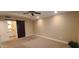 Large bedroom features a barn door to the bathroom and recessed lighting at 5640 E Bell Rd # 1047, Scottsdale, AZ 85254
