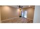 A clean bedroom featuring tile floors and a sliding glass door leading to a private backyard area at 5640 E Bell Rd # 1047, Scottsdale, AZ 85254