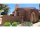 Charming home exterior with stucco walls, red tile roof, and desert landscaping at 5640 E Bell Rd # 1047, Scottsdale, AZ 85254