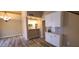 Modern kitchen with white cabinets, stainless steel appliances, and stylish pendant lighting at 5640 E Bell Rd # 1047, Scottsdale, AZ 85254