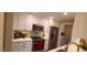 Updated kitchen featuring stainless steel appliances, white cabinetry, and modern countertops at 5640 E Bell Rd # 1047, Scottsdale, AZ 85254
