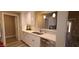Bright kitchen with stainless steel appliances, white cabinets, updated countertops, and tile backsplash at 5640 E Bell Rd # 1047, Scottsdale, AZ 85254