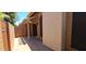A charming patio with pavers, partial shade, and a secure gate offering privacy and outdoor enjoyment at 5640 E Bell Rd # 1047, Scottsdale, AZ 85254
