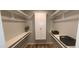 Walk-in closet includes built in shelving and hanging rods for ample storage at 5640 E Bell Rd # 1047, Scottsdale, AZ 85254