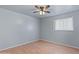 Bedroom featuring light gray walls and a ceiling fan at 5802 N 61St Dr, Glendale, AZ 85301