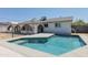 Backyard pool with clean blue water and a view of the home's exterior at 5802 N 61St Dr, Glendale, AZ 85301