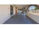 Covered outdoor porch space with arched openings offering views of the backyard and pool at 5802 N 61St Dr, Glendale, AZ 85301