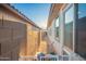 Narrow side yard with pet-friendly artificial turf at 5897 N 195Th Dr, Litchfield Park, AZ 85340