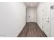 Inviting entryway with wood-look flooring and bright white walls at 5897 N 195Th Dr, Litchfield Park, AZ 85340