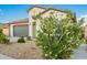 Charming single-story home featuring a well-maintained yard and a two-car garage at 5897 N 195Th Dr, Litchfield Park, AZ 85340