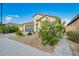Charming single-story home featuring a well-maintained yard and a two-car garage at 5897 N 195Th Dr, Litchfield Park, AZ 85340