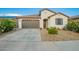 Charming single-story home with desert landscaping and spacious driveway at 5897 N 195Th Dr, Litchfield Park, AZ 85340