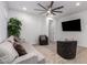 Cozy living area with comfortable seating, a large TV, and plenty of natural light, great for entertaining at 5897 N 195Th Dr, Litchfield Park, AZ 85340