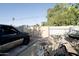 The backyard features a black truck parked near the block wall fence and various items scattered around at 6101 N 31St Dr, Phoenix, AZ 85017
