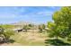 Expansive grassy lot with mature trees and mountain views, perfect for building your dream home at 6147 E Lewis Ave, Scottsdale, AZ 85257