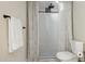 Modern bathroom featuring a tiled shower with rainfall shower head at 6147 E Lewis Ave, Scottsdale, AZ 85257