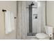 Modern bathroom featuring a tiled shower with rainfall shower head at 6147 E Lewis Ave, Scottsdale, AZ 85257