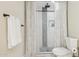 Modern bathroom featuring a tiled shower with rainfall shower head at 6147 E Lewis Ave, Scottsdale, AZ 85257