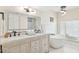 Luxurious bathroom with dual sinks, sleek fixtures, and a soaking tub at 6147 E Lewis Ave, Scottsdale, AZ 85257