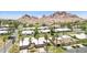Spacious community with lush green lawns, palm trees, and gorgeous mountain views in a desirable location at 6147 E Lewis Ave, Scottsdale, AZ 85257
