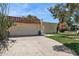 Charming home with a stucco wall, tile roof, paved driveway, and desert landscaping at 6147 E Lewis Ave, Scottsdale, AZ 85257