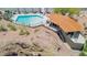 Luxurious pool and patio with red tile roof and desert surroundings, ideal for upscale living and entertaining at 6147 E Lewis Ave, Scottsdale, AZ 85257