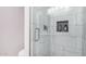 Modern glass-enclosed shower with built-in niche and sleek fixtures in a beautifully tiled bathroom at 6480 N 82Nd St # 1136, Scottsdale, AZ 85250