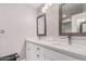 Modern bathroom with dual sinks, quartz countertops, and a white vanity at 6480 N 82Nd St # 1136, Scottsdale, AZ 85250