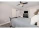 Neutral bedroom with a ceiling fan, wood floors, and ensuite bathroom at 6480 N 82Nd St # 1136, Scottsdale, AZ 85250