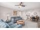 Well-lit living room showcasing stylish seating, decorative wall art, and open access to dining at 6480 N 82Nd St # 1136, Scottsdale, AZ 85250