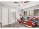 Comfortable living room with a gray sofa, orange chairs, and wood flooring at 6480 N 82Nd St # 1136, Scottsdale, AZ 85250