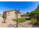 Picture of a lovely backyard with manicured lawn, gravel landscaping, and patio area at 6620 S 16Th Dr, Phoenix, AZ 85041