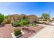 Inviting home with desert landscaping, a two-car garage, and a charming facade at 6620 S 16Th Dr, Phoenix, AZ 85041