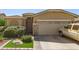 Charming single-Gathering home with a two-car garage, lush landscaping, and stone accents at 6620 S 16Th Dr, Phoenix, AZ 85041