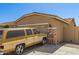 Tan single-Gathering home featuring a two-car garage with stone accents at 6620 S 16Th Dr, Phoenix, AZ 85041
