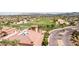 An elevated view of the lush golf course with mountains in the background at 7050 S Fawn Ave, Gilbert, AZ 85298