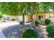 Well-maintained home with mature shade tree enhancing the curb appeal at 7050 S Fawn Ave, Gilbert, AZ 85298